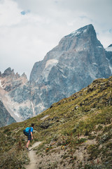 Fototapeta premium young woman hiking in the mountains of Georgia, Caucasus mountain