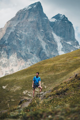 Fototapeta na wymiar young man hiking in the mountains of Georgia, Caucasus mountain