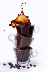 in glass cups, animated sequence vertically with coffee beans, ground coffee, and drink with...