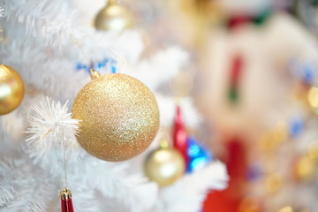 Christmas tree (white and green colour) and new year decoration in the department store.