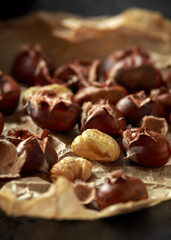 Roasted chestnuts served on crumpled paper