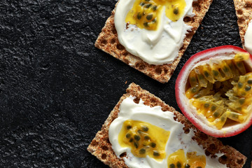 Rye breads with soy curd and maracuja, passion fruit. healthy breakfast