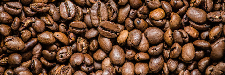 coffee grain (good and bad grain) - Arabica and Robusta blend (roasted coffee grain). Black background. Top view . Copy space.