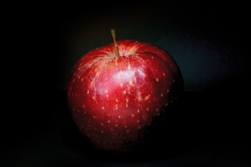 Red fresh apple with on black background