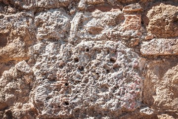 Texture of ancient wall build from bricks and stones