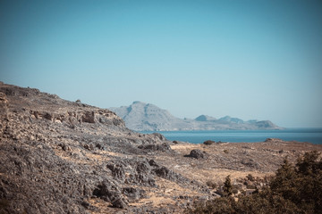 Fototapeta na wymiar Rocks and hills on Rhodes island near Lindos town