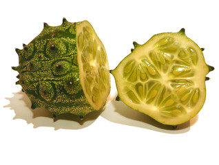 Naklejka premium Sliced green kiwano isolated on white background, two halves. (Cucumis metuliferus, Horned melon or African horned cucumber)