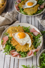 Potato pancakes with eggs and ham