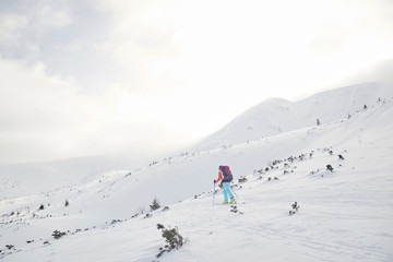 Skitouring with amazing view of mountains in beautiful winter powder snow