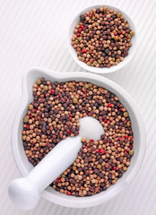 MIXED PEPPERCORNS IN PESTLE AND MORTAR
