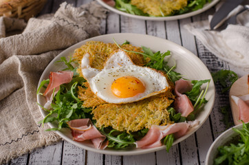 Potato pancakes with eggs and ham