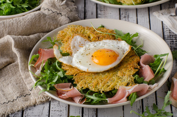 Potato pancakes with eggs and ham