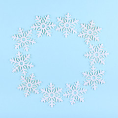 New Year composition with snowflakes. Christmas concept background. Flat lay, top view of festive still life