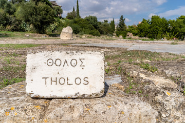 Close up of a stone sign marker indicating the name of ruins in the historic Ancient Agora, in Athens, Greece.