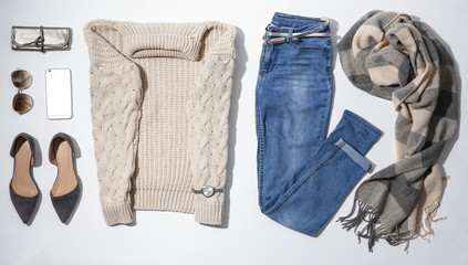 Flat lay composition with set of stylish winter outfit on white background
