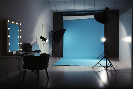 Modern photo studio interior with professional lighting equipment