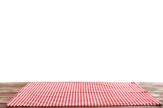 Checkered napkin on table against white background