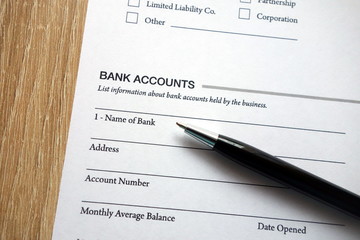 Bank accounts heading on document and pen