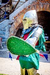 Medieval knight in a combat armor before the fight_
