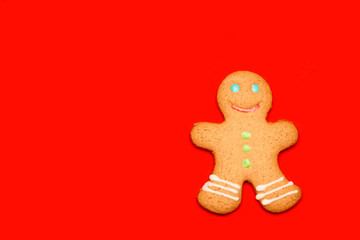 Christmas Gingerbread man biscuit on red background