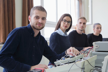Group of young students in technical vocational training with teacher, the lesson in technical...