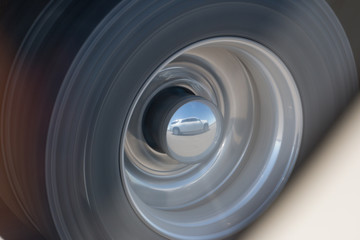 reflection of a truck on a wheel