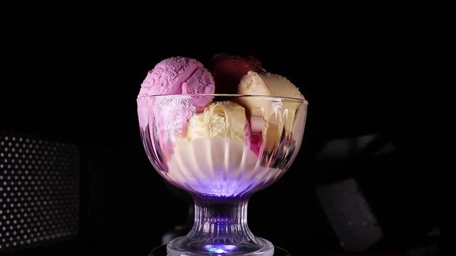 Chocolate vanilla and fruit ice cream in bowl sundae