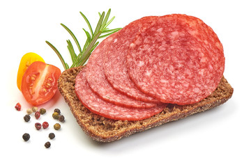 Sandwich with Dried Salami Sausage Slices and tomatoes, isolated on a white background. Close-up
