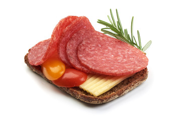 Sandwich with Dried Salami Sausage Slices and tomatoes, isolated on a white background. Close-up