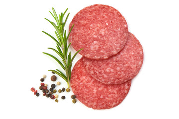 Dried Salami Sausage Slices with rosemary and peppercorns, isolated on a white background. Top view