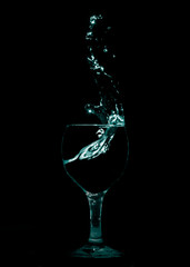 Splash of water from glass in thick smoke