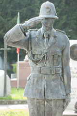 old funeral statues of policeman