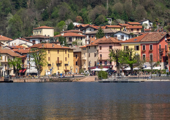 Obraz premium colorful lakefront of a small Italian village. Porto Ceresio, Lugano Lake