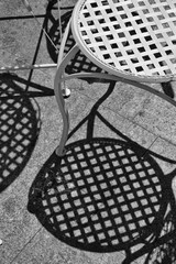Black and white metal chairs in a cafe