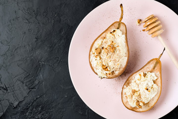 healthy vegan dessert, baked pears with nuts and honey.Selective focus