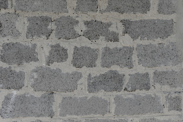 Closeup of brick cement stone wall background texture
