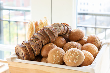 Sliced bread and roles in a basket