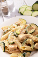 Penne pasta witch chicken and zucchini in cheese sauce