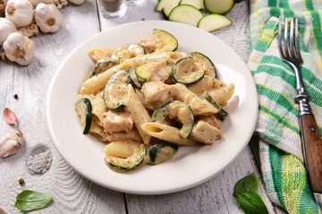 Penne pasta witch chicken and zucchini in cheese sauce