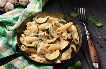 Penne pasta witch chicken and zucchini in cheese sauce