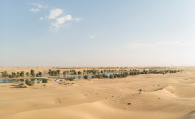 couple in a desert near Al Qudra Lakes near Dubai