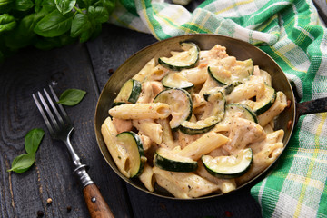 Penne pasta witch chicken and zucchini in cheese sauce