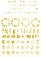 Gold foil set of Christmas wreath, plants, stars and snowflakes. Vintage isolated decorative elements. Holiday flourishes.