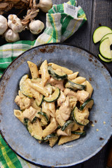 Penne pasta witch chicken and zucchini in cheese sauce
