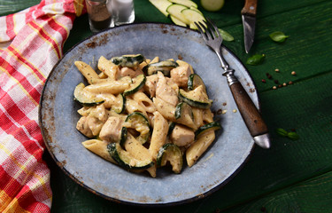 Penne pasta witch chicken and zucchini in cheese sauce