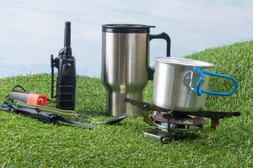 concept on the grass and blue background things to survive in nature