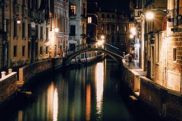 small canal in Venice at night