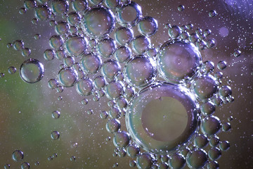Image of oil bubbles in liquid texture on colorful background