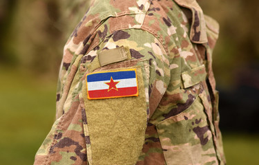 Yugoslavia flag on soldiers arm (collage).
