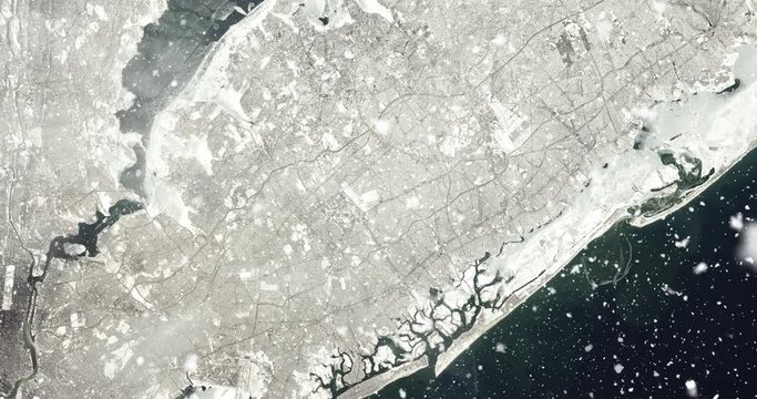 Vertical aerial ascent through heavy falling snow, over New York City. Elements of this image furnished by NASA. 
